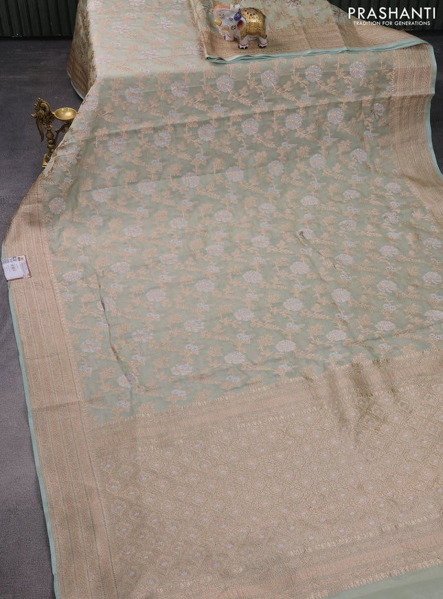 Banarasi tissue silk saree pastel green shade with allover thread & zari woven floral weaves and zari woven border