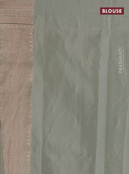 Banarasi tissue silk saree pastel green shade with allover thread & zari woven floral weaves and zari woven border