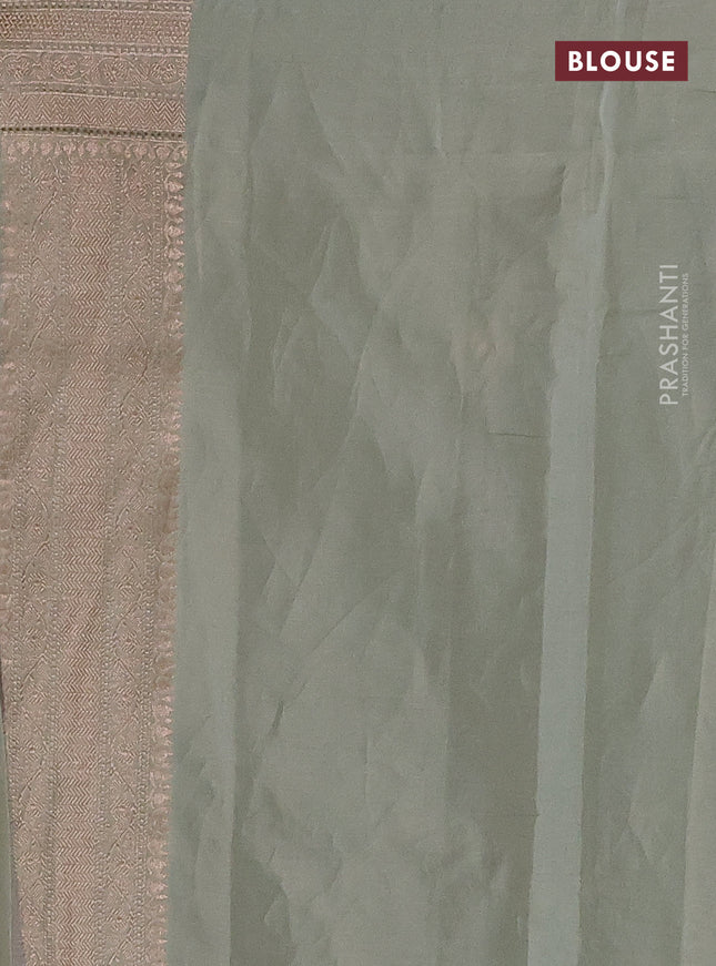 Banarasi tissue silk saree pastel green shade with allover thread & zari woven floral weaves and zari woven border