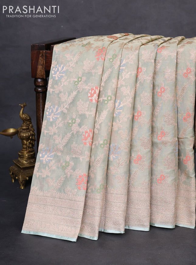 Banarasi tissue silk saree pastel green shade with allover thread & zari woven floral weaves and zari woven border