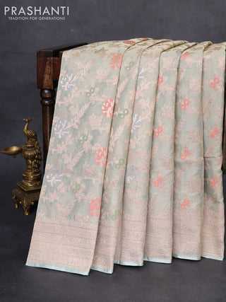 Banarasi tissue silk saree pastel green shade with allover thread & zari woven floral weaves and zari woven border