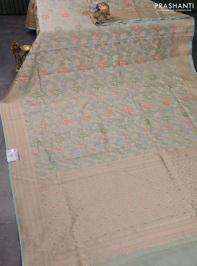 Banarasi tissue silk saree pastel green shade with allover thread & zari woven floral weaves and zari woven border