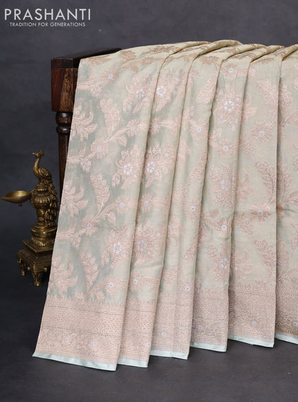 Banarasi tissue silk saree pastel green with allover zari woven brocade weaves and zari woven border
