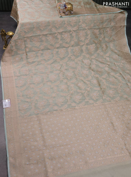 Banarasi tissue silk saree pastel green with allover zari woven brocade weaves and zari woven border