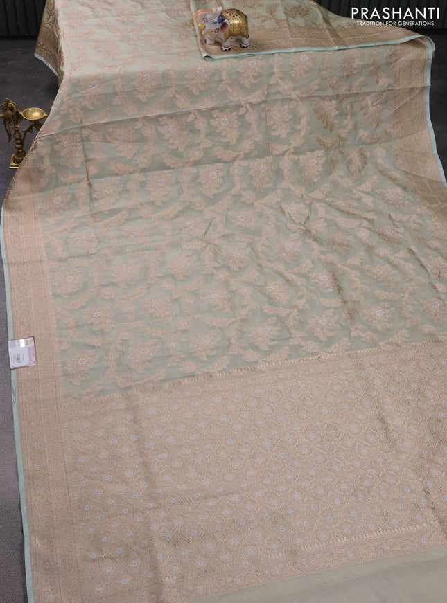 Banarasi tissue silk saree pastel green with allover zari woven brocade weaves and zari woven border