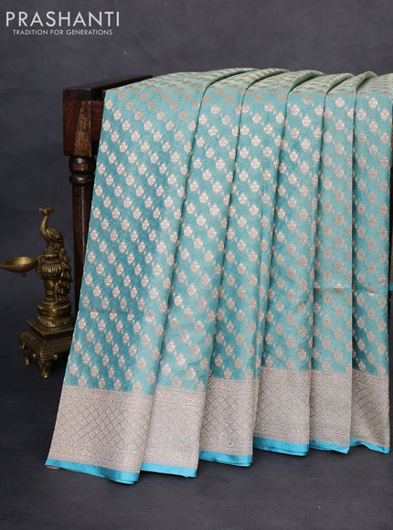 Banarasi tissue silk saree teal blue with allover zari woven brocade weaves and zari woven border