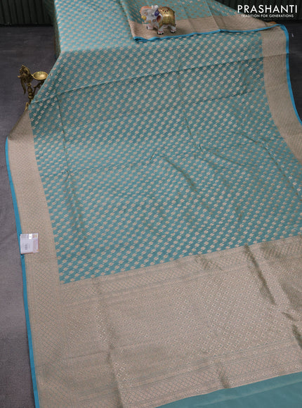 Banarasi tissue silk saree teal blue with allover zari woven brocade weaves and zari woven border
