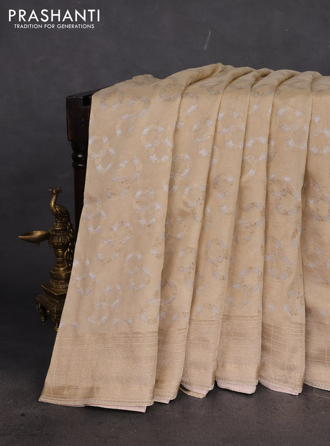 Banarasi silk saree cream with allover silver & gold zari woven buttas and gotapatti work pallu
