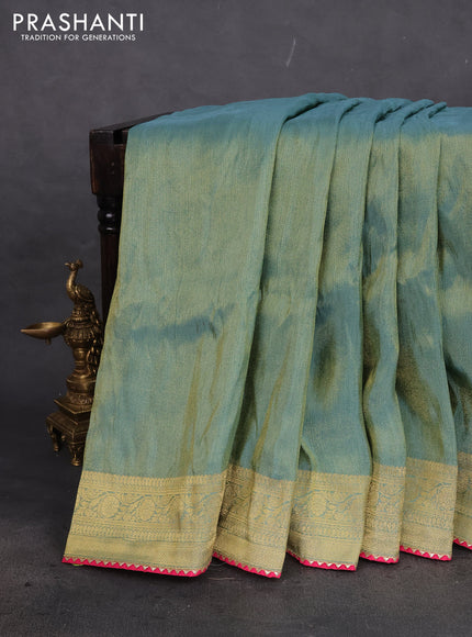 Banarasi silk saree pastel green and multi colour with plain body and zari woven border