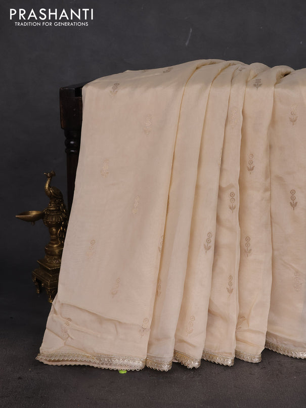 Munga tussar silk saree cream with zari woven buttas and lace work border