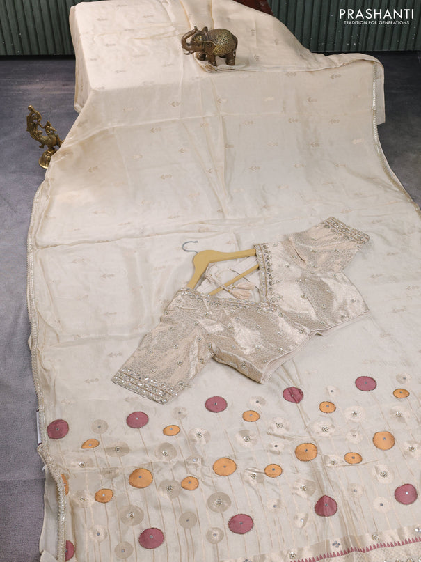Munga tussar silk saree cream with zari woven buttas and lace work border