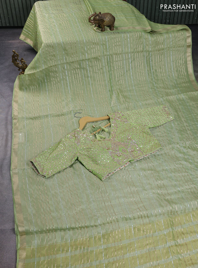 Tissue silk saree light green with allover silver & gold zari weaves and zari woven border