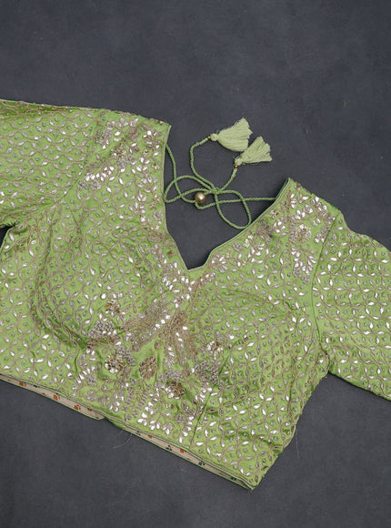 Tissue silk saree light green with allover silver & gold zari weaves and zari woven border