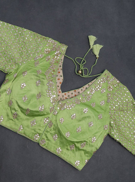 Tissue silk saree light green with allover silver & gold zari weaves and zari woven border