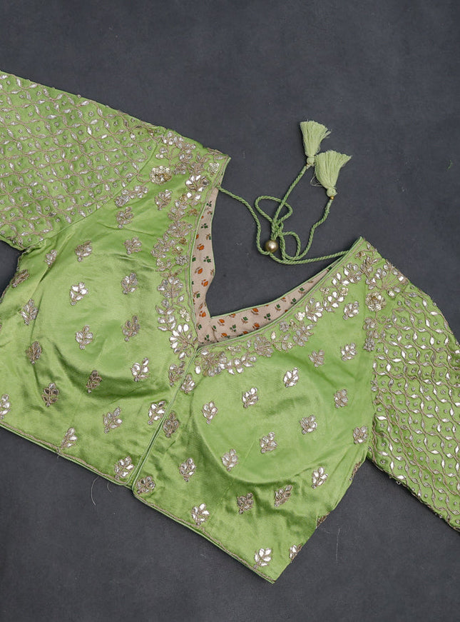 Tissue silk saree light green with allover silver & gold zari weaves and zari woven border