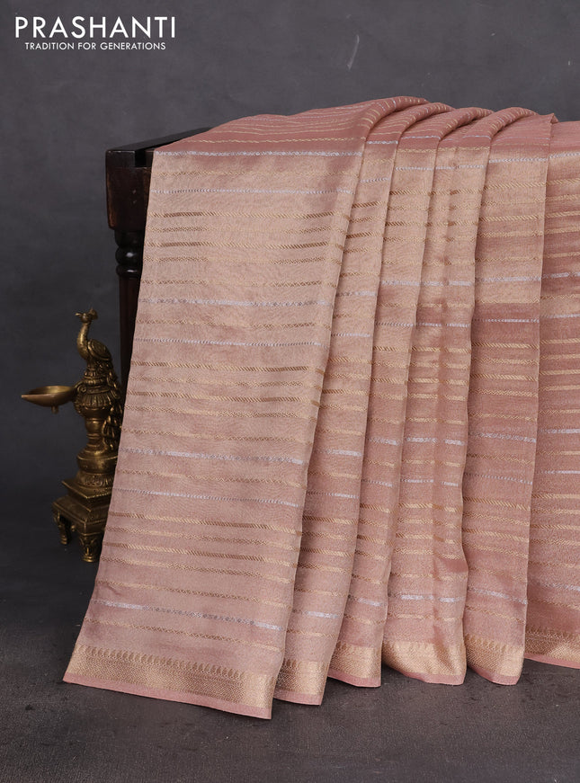 Tissue silk saree pastel peach with allover silver & gold zari weaves and zari woven border