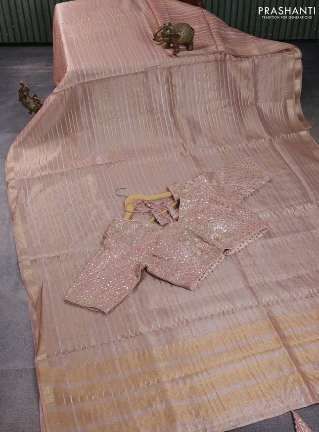 Tissue silk saree pastel peach with allover silver & gold zari weaves and zari woven border