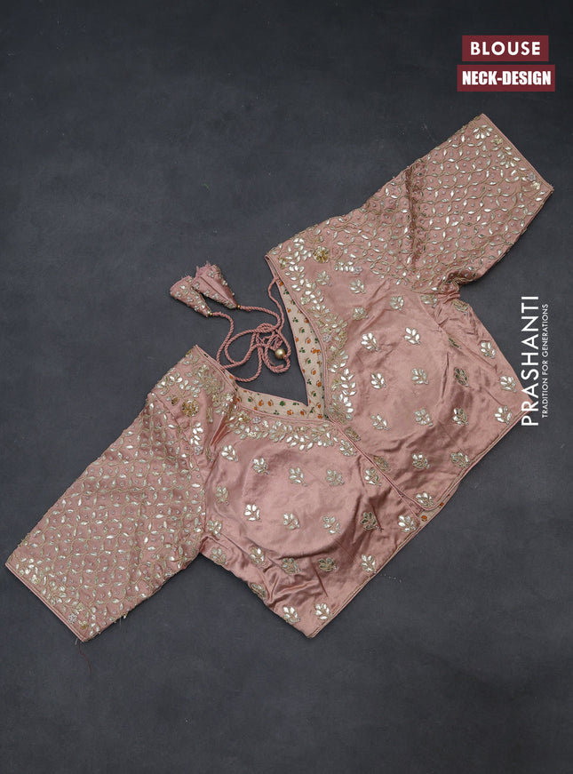 Tissue silk saree pastel peach with allover silver & gold zari weaves and zari woven border