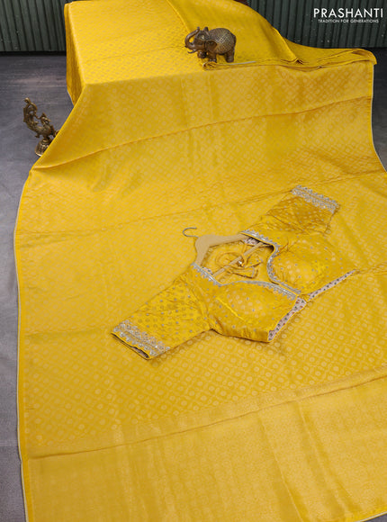 Banarasi silk saree yellow with allover zari woven brocade weaves and lace work border