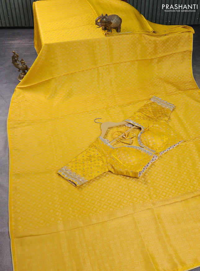 Banarasi silk saree yellow with allover zari woven brocade weaves and lace work border