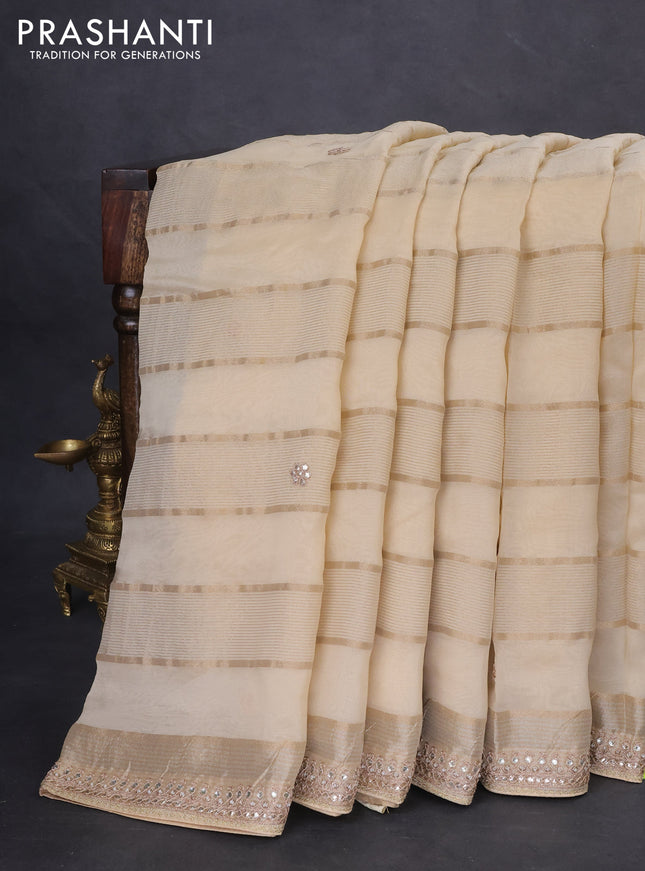 Organza saree beige and black with allover zari weaves & gotapatti work butta and embrodery stone work border