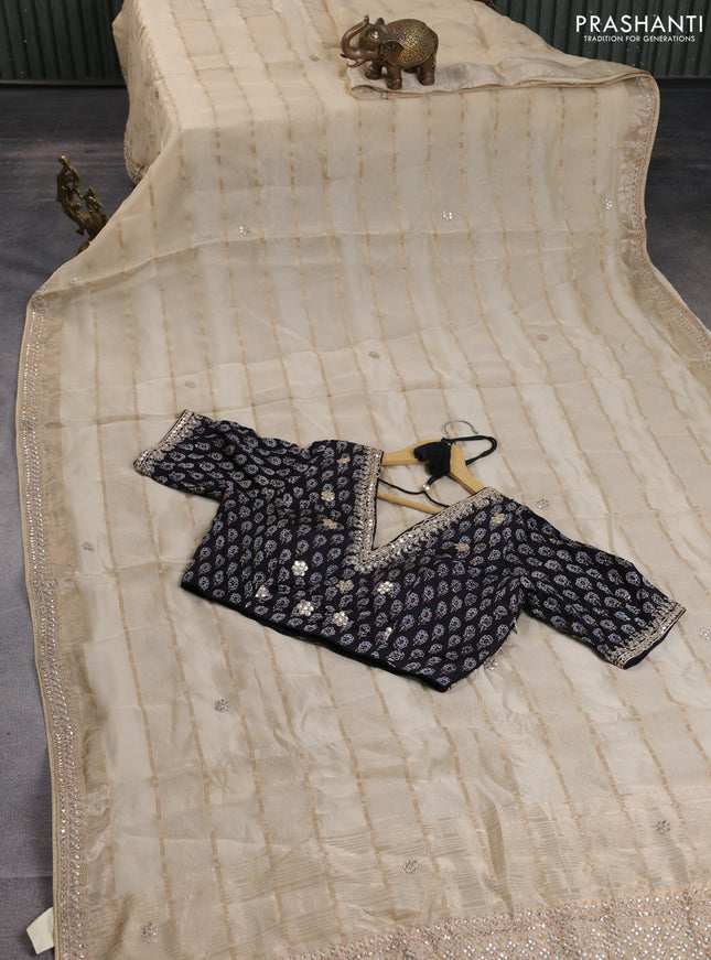 Organza saree beige and black with allover zari weaves & gotapatti work butta and embrodery stone work border