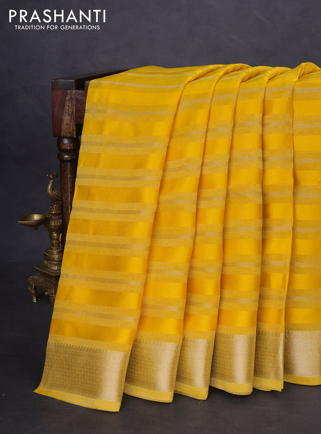 Organza saree yellow with allover zari stripe pattern and zari woven border