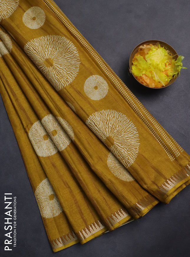 Semi raw silk saree mustard yellow with butta prints and temple design zari woven border
