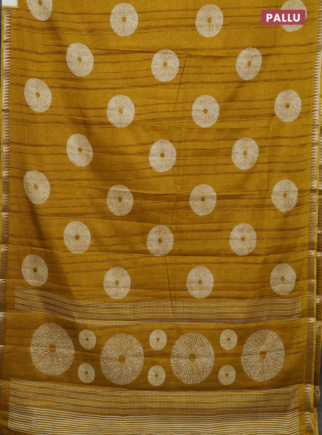Semi raw silk saree mustard yellow with butta prints and temple design zari woven border