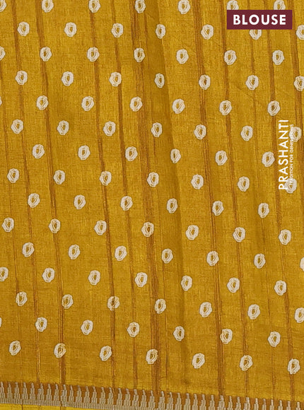 Semi raw silk saree mustard yellow with butta prints and temple design zari woven border