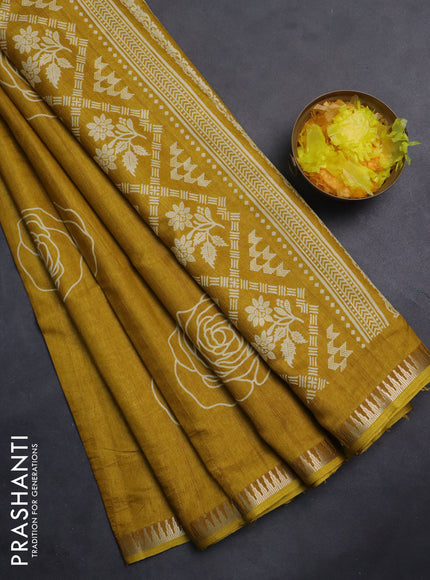 Semi raw silk saree mustard yellow with floral butta prints and temple design zari woven border
