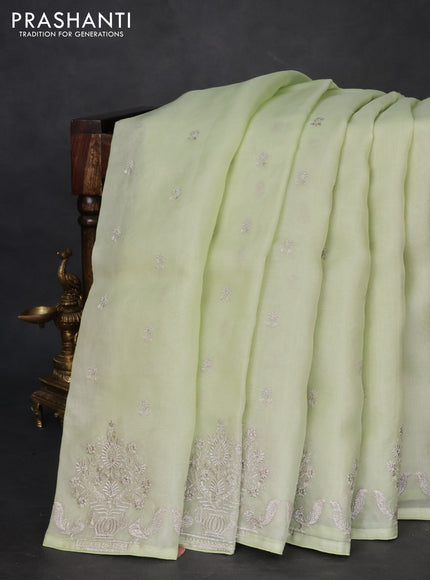 Pure organza silk saree pista green with embroidery buttas and embroidery border
