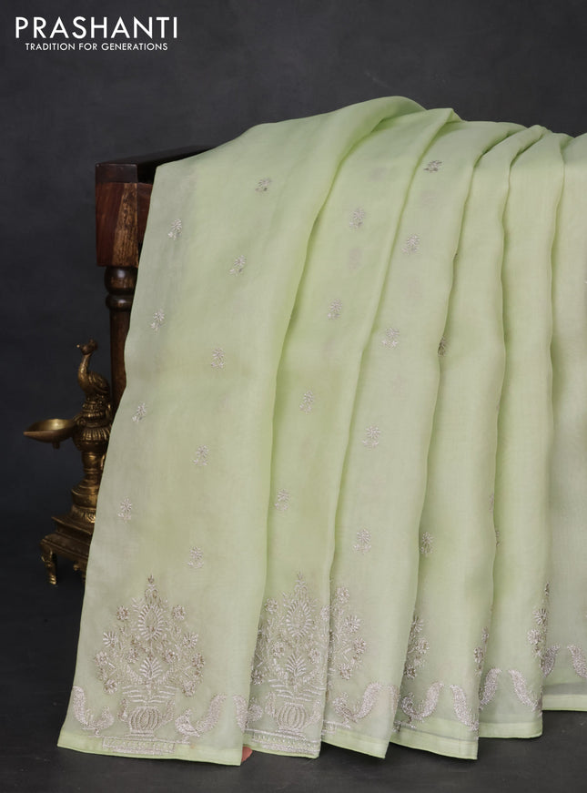Pure organza silk saree pista green with embroidery buttas and embroidery border