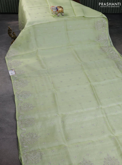 Pure organza silk saree pista green with embroidery buttas and embroidery border
