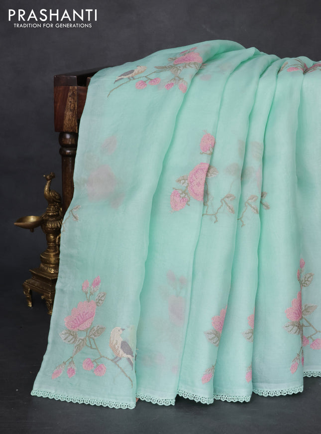 Pure organza silk saree teal green with allover floral embroidery and lace woven border