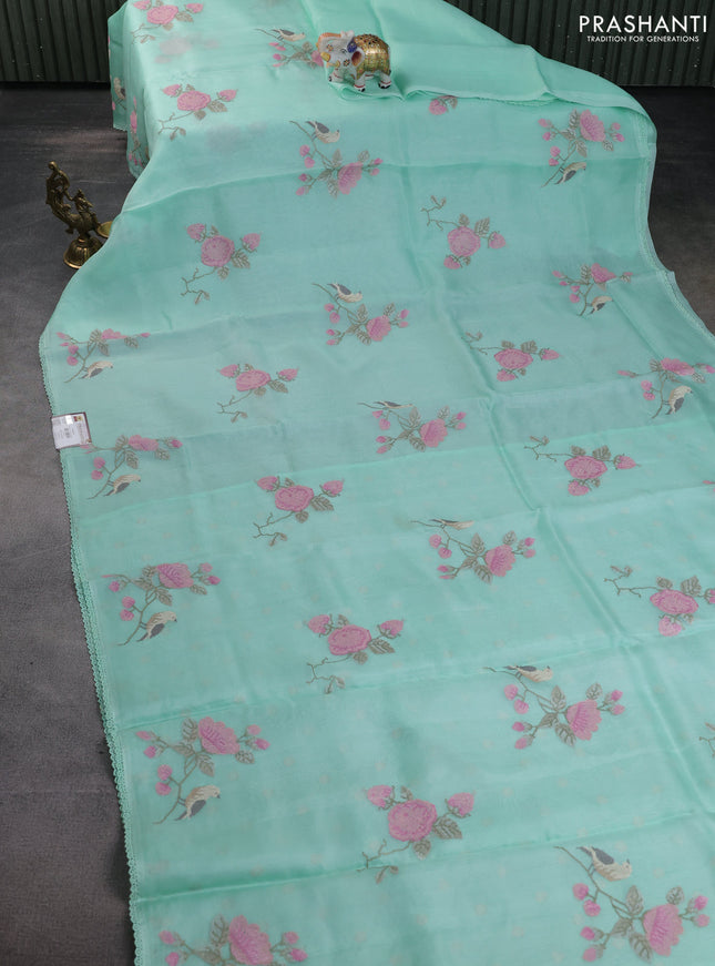 Pure organza silk saree teal green with allover floral embroidery and lace woven border