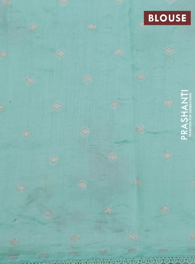 Pure organza silk saree teal green with allover floral embroidery and lace woven border