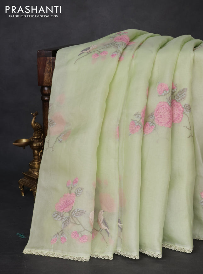 Pure organza silk saree pista green with allover floral embroidery and lace woven border