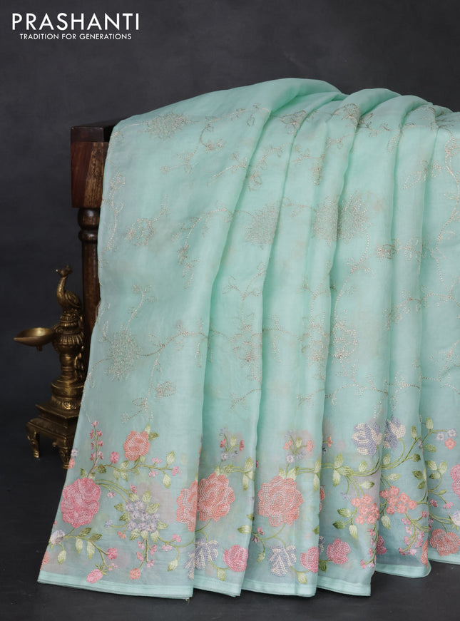 Pure organza silk saree teal green with allover embroidery and floral embroidery border