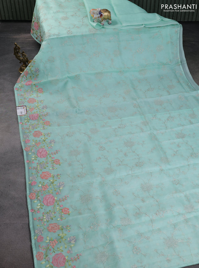 Pure organza silk saree teal green with allover embroidery and floral embroidery border