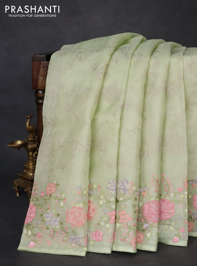 Pure organza silk saree pista green with allover embroidery and floral embroidery border
