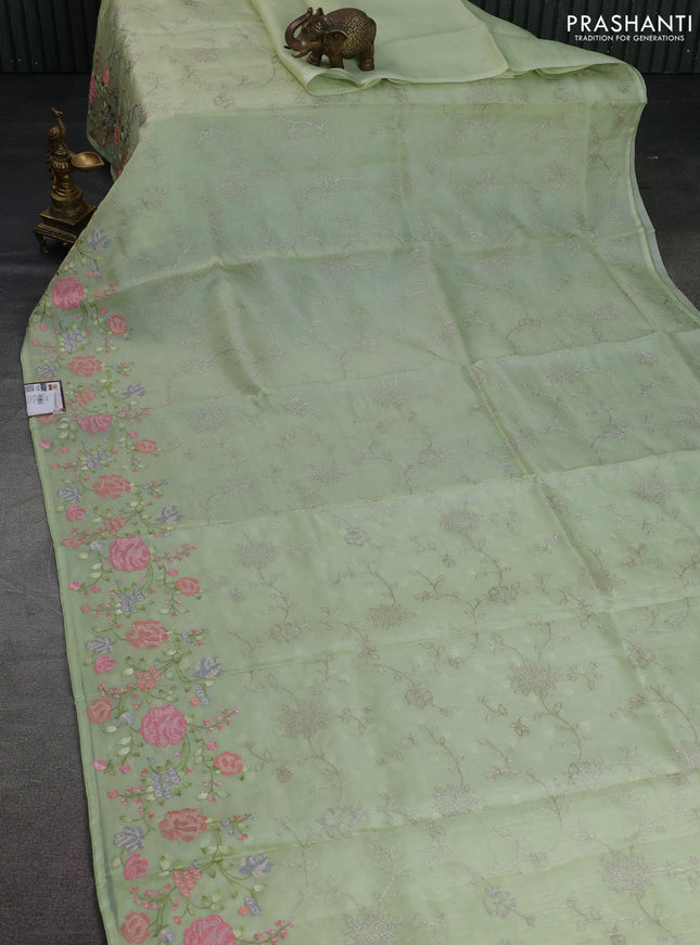 Pure organza silk saree pista green with allover embroidery and floral embroidery border