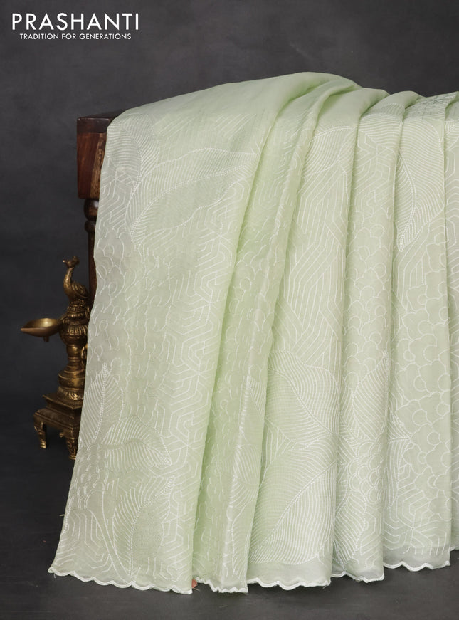 Pure organza silk saree pista green with allover embroidery and scallop border