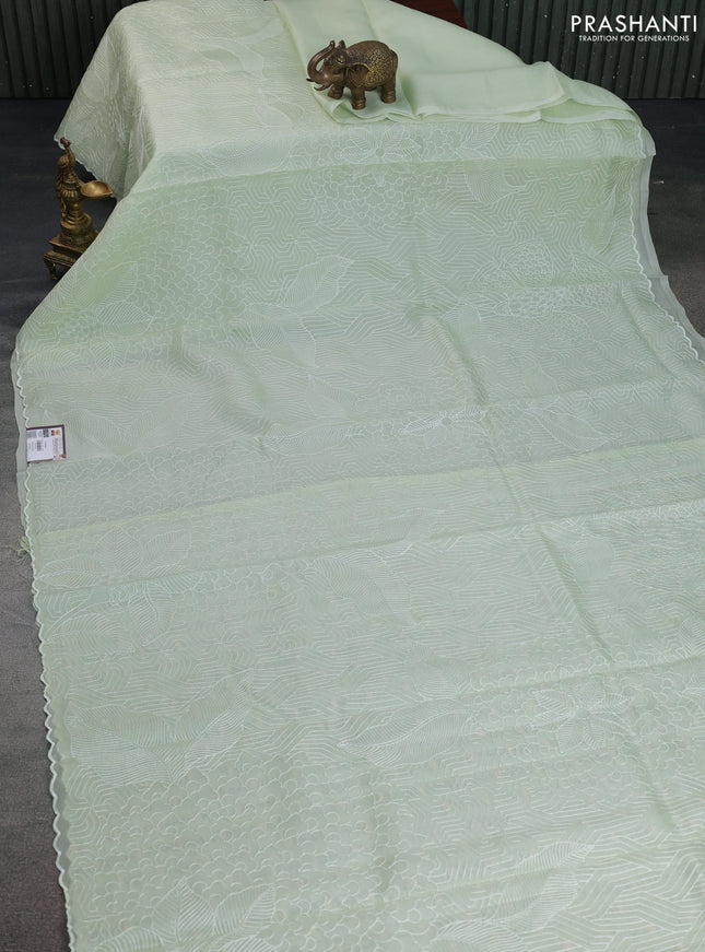 Pure organza silk saree pista green with allover embroidery and scallop border