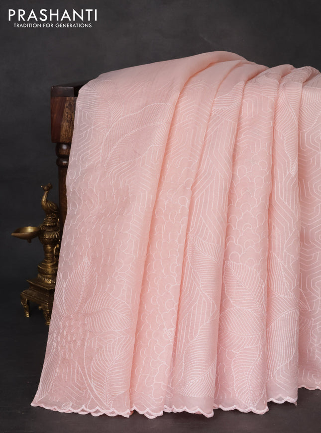 Pure organza silk saree mild peach with allover embroidery and scallop border