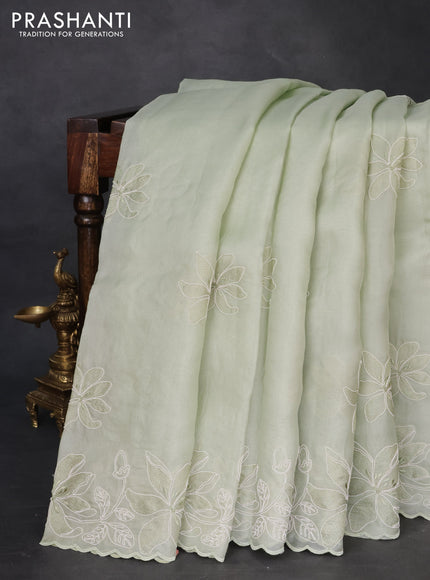 Pure organza silk saree pastel green with floral embroidery and scallop border