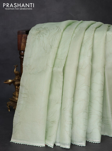Pure organza silk saree pastel green with allover embroidery and lace work border