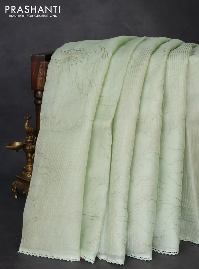 Pure organza silk saree pastel green with allover embroidery and lace work border