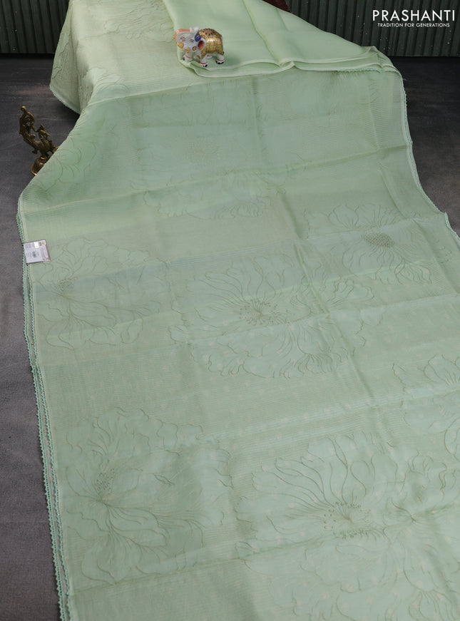 Pure organza silk saree pastel green with allover embroidery and lace work border