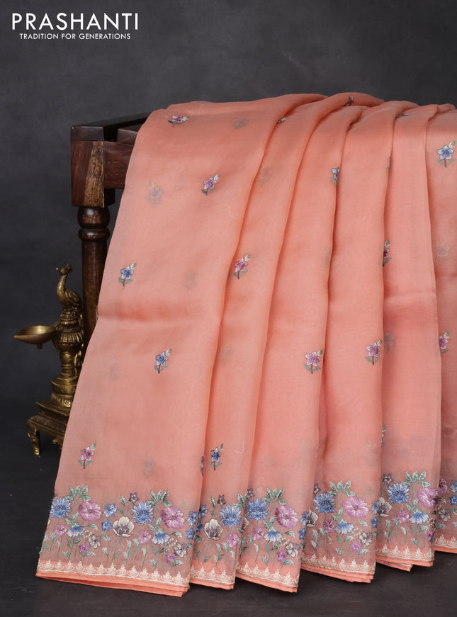 Pure organza silk saree peach orange with allover embroidery buttas and floral embroidery border